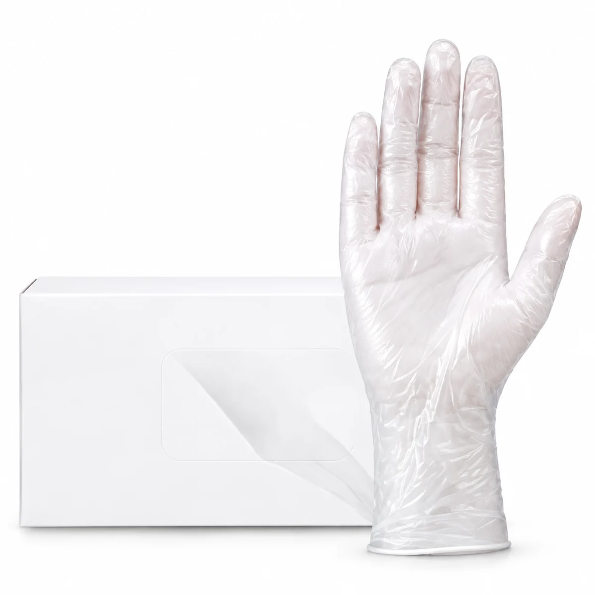 A clear disposable PVC examination glove beside a plain white dispenser box, on a white background
