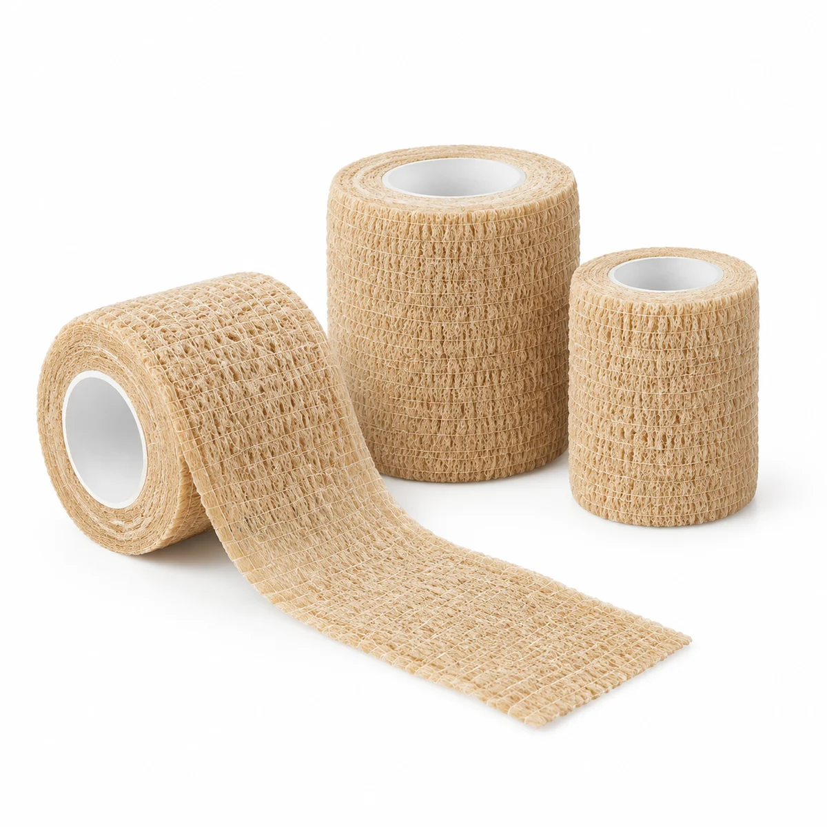 Rolls of tan self-adhesive elastic wrap, on a white background